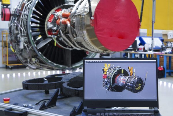This is a photo of an engine inspection with an automated drone and the software showing a 3D reconstruction of the part